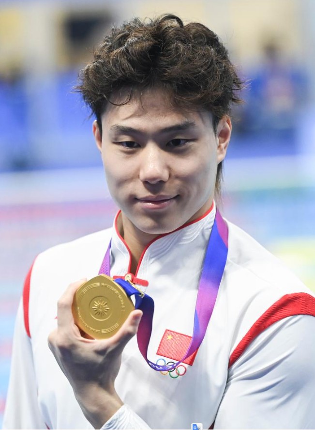覃海洋在男子50米蛙泳決賽中奪得金牌。新華社