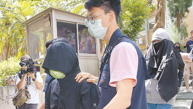 涉嫌恐嚇京華城案檢察官的周姓男子(左)及林姓女子(右)3日落網(wǎng)。